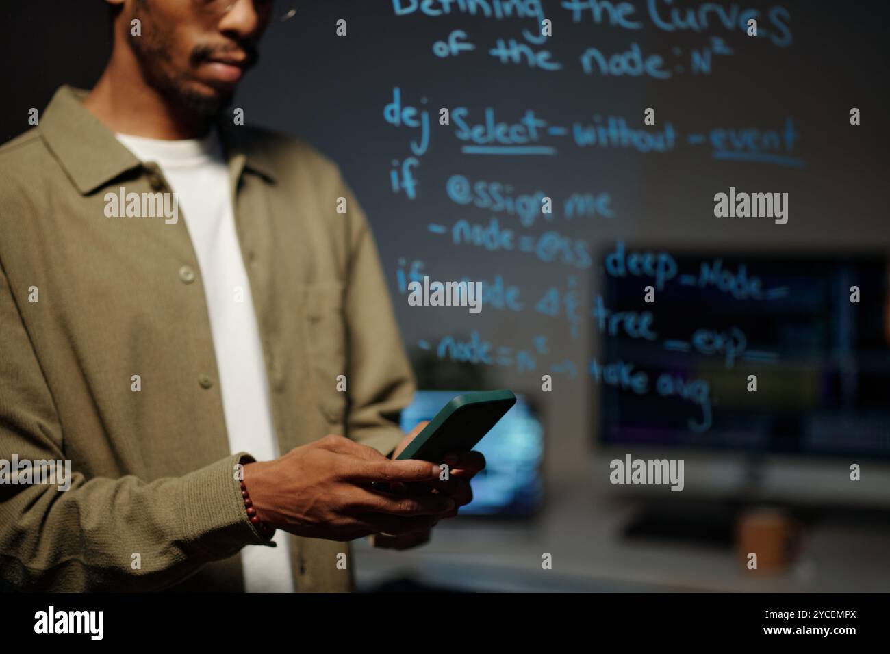 Collaborating on Coding Project in Modern Workspace Stock Photo