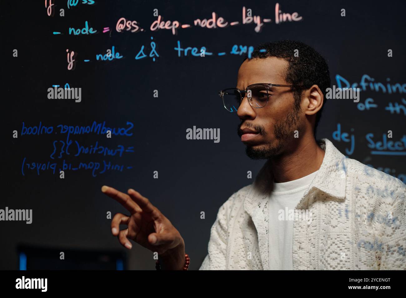 Writing Code on Transparent Screen for Developing Application Stock Photo