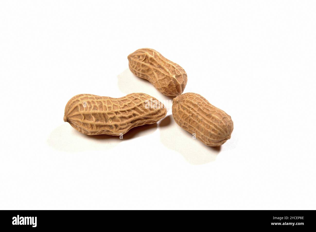 Close View of Peanuts against white background Stock Photo