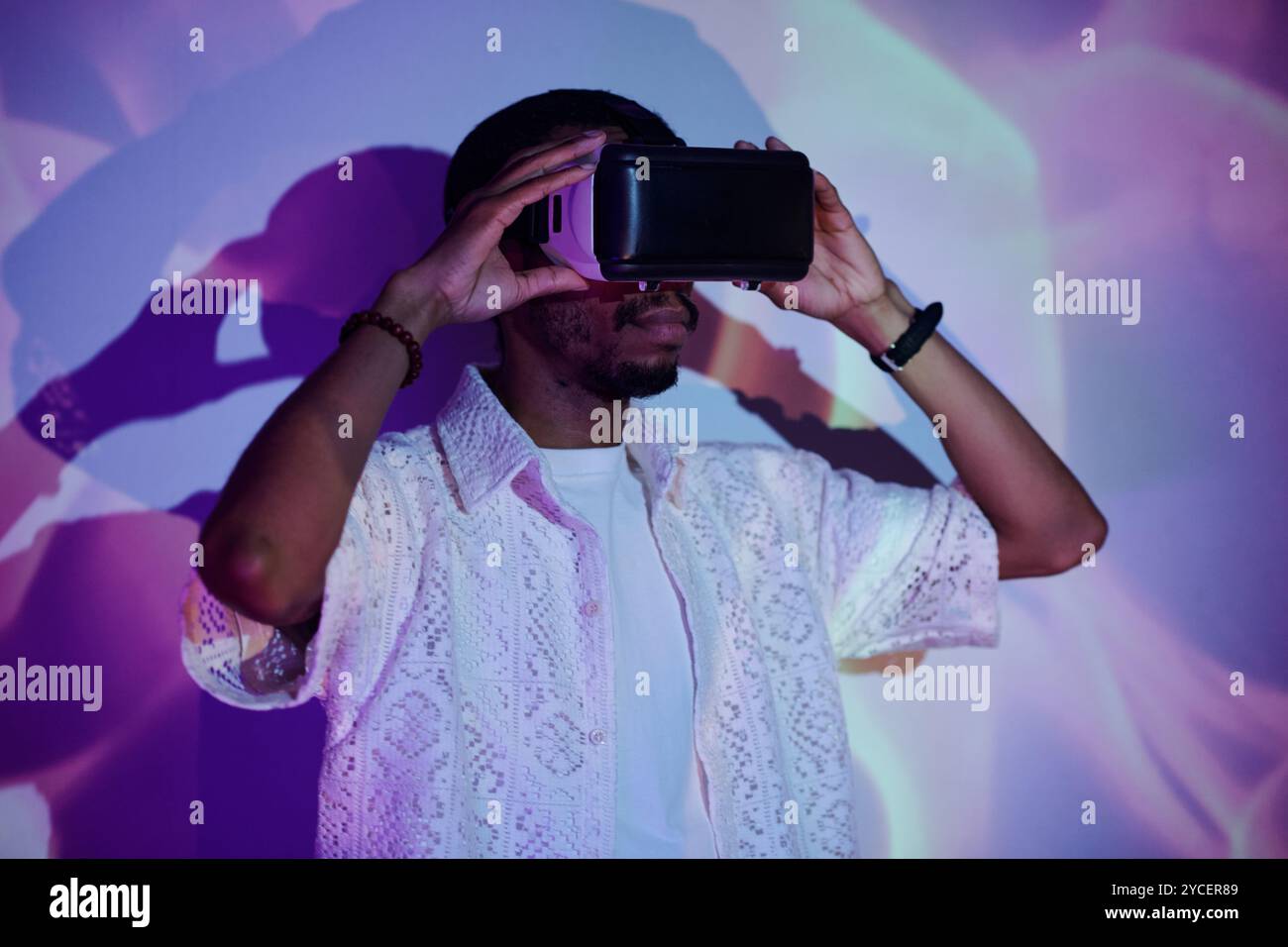 Engaging with Virtual Reality Headset Experience Stock Photo
