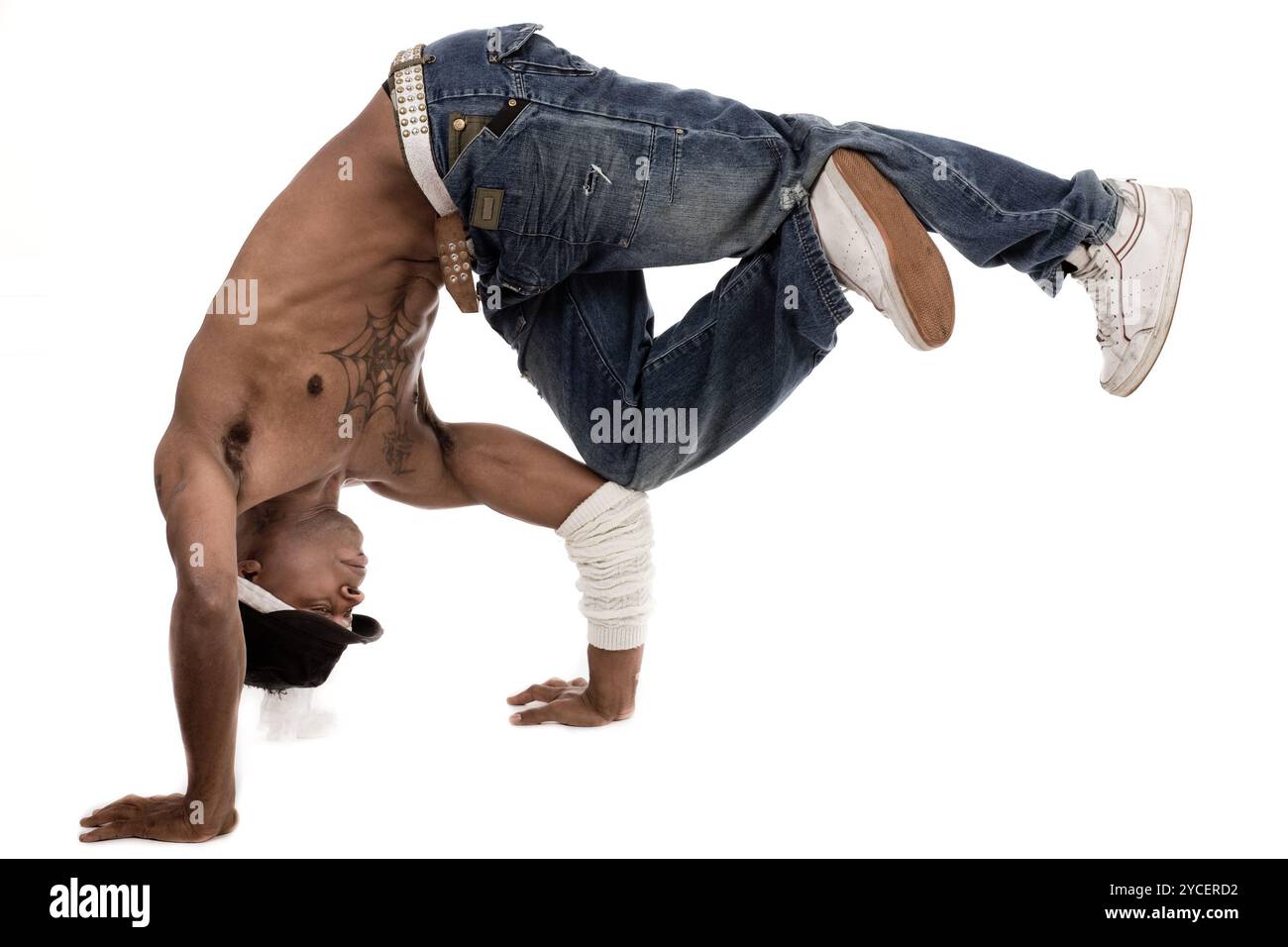 Dancer balancing his knees with his elbows on isolated white background ...