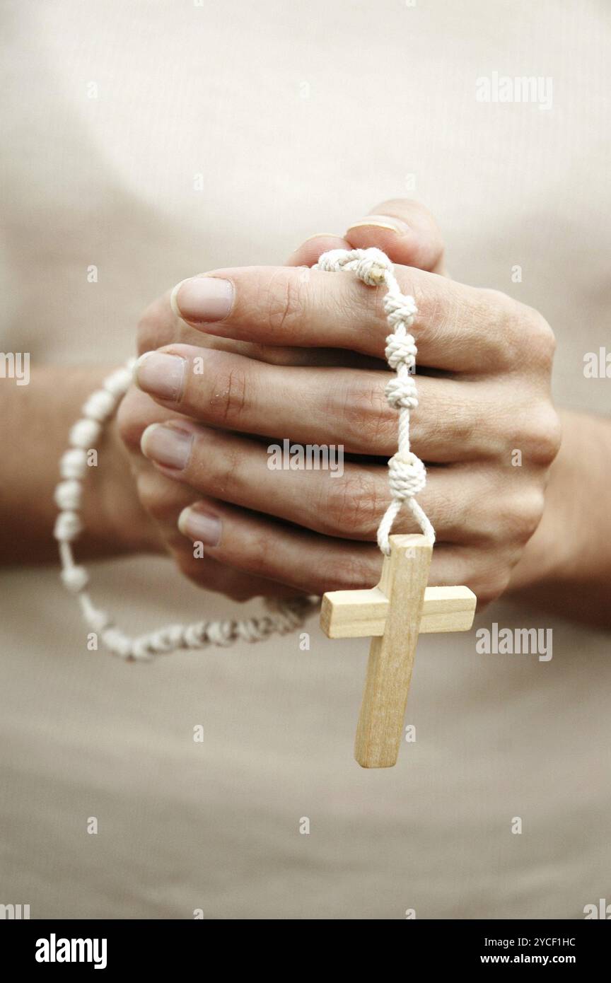 Praying hands woman rosary hi-res stock photography and images - Alamy