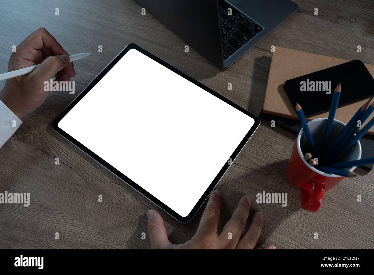 Digital tablet with blank screen for design mockup holding blank screen tablet Stock Photo