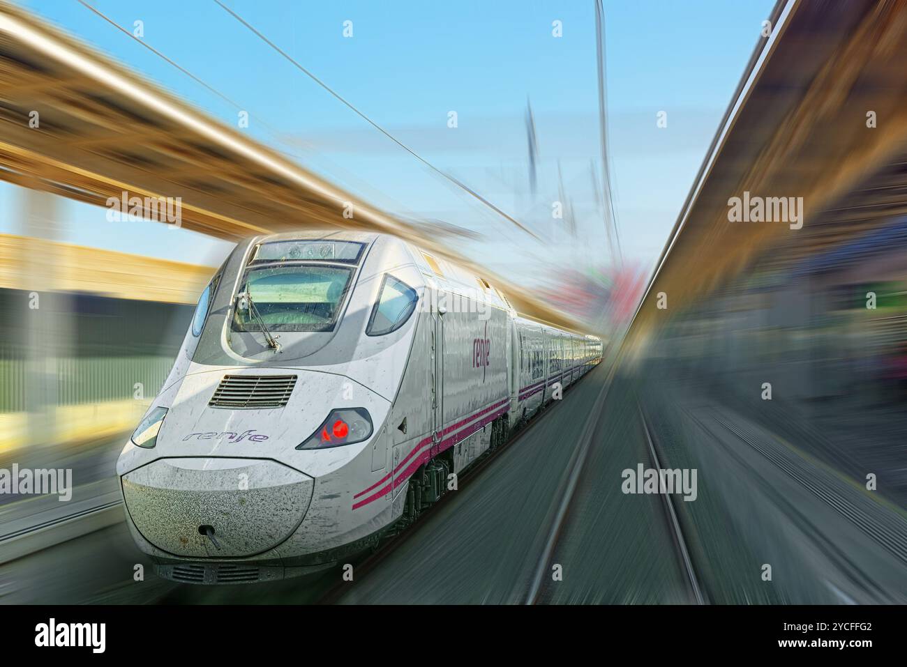 Madrid, Spain - June 08, 2017 : Modern hi-speed passenger train of Spanish Railways Company - Renfe, in  movement (motion). Stock Photo