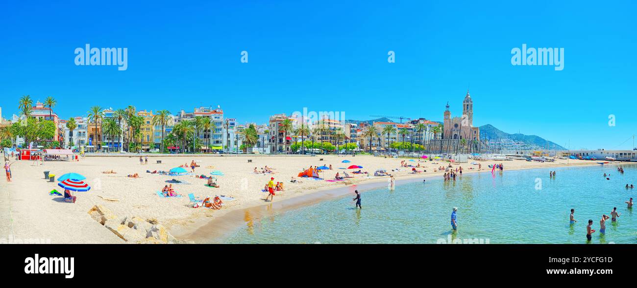 Sitges, Spain - June 14, 2017 : View of the beach and the sea shore of a small resort town Sitges in the suburbs of Barcelona. Stock Photo