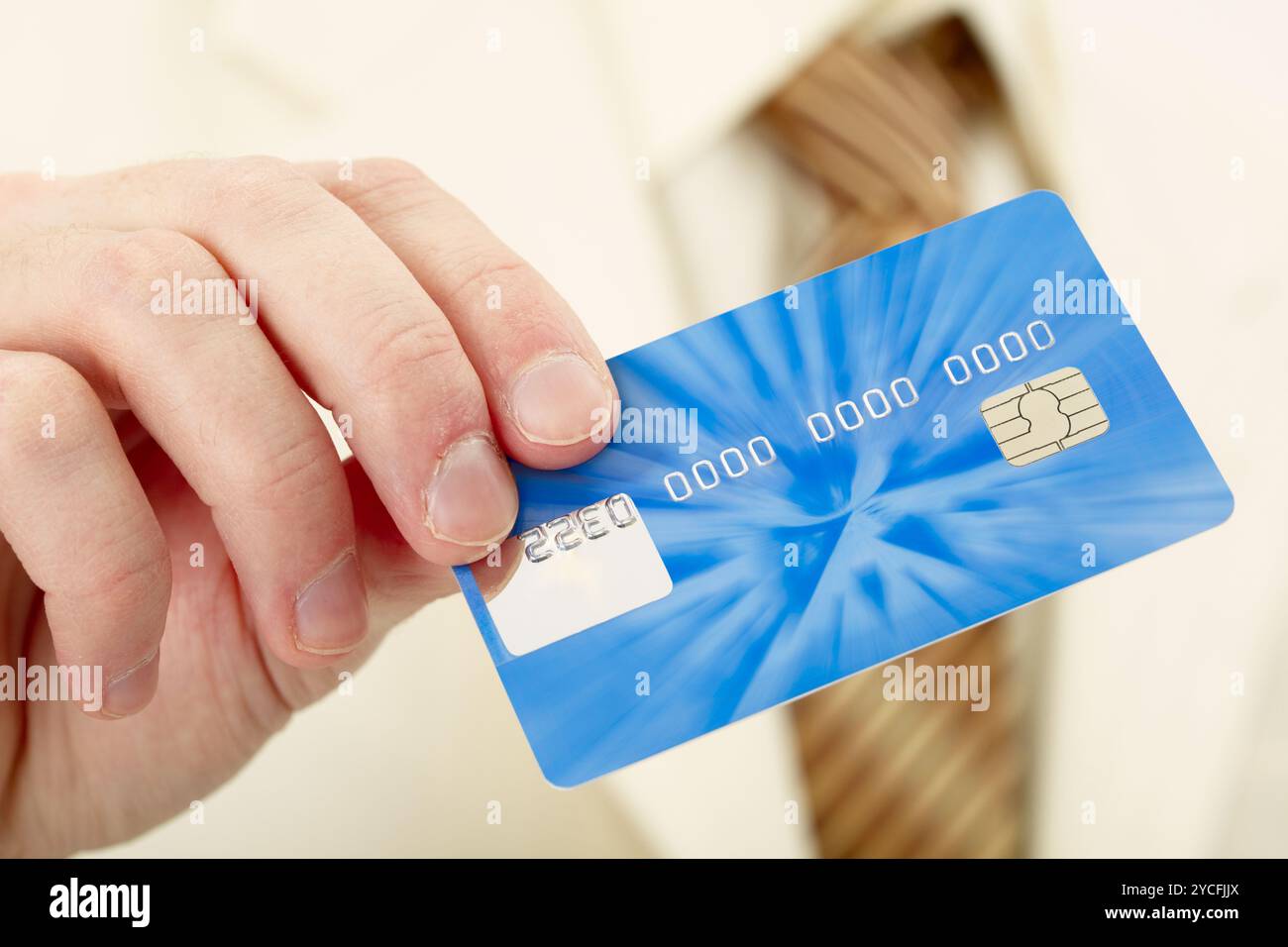 Businessman shows credit card Stock Photo