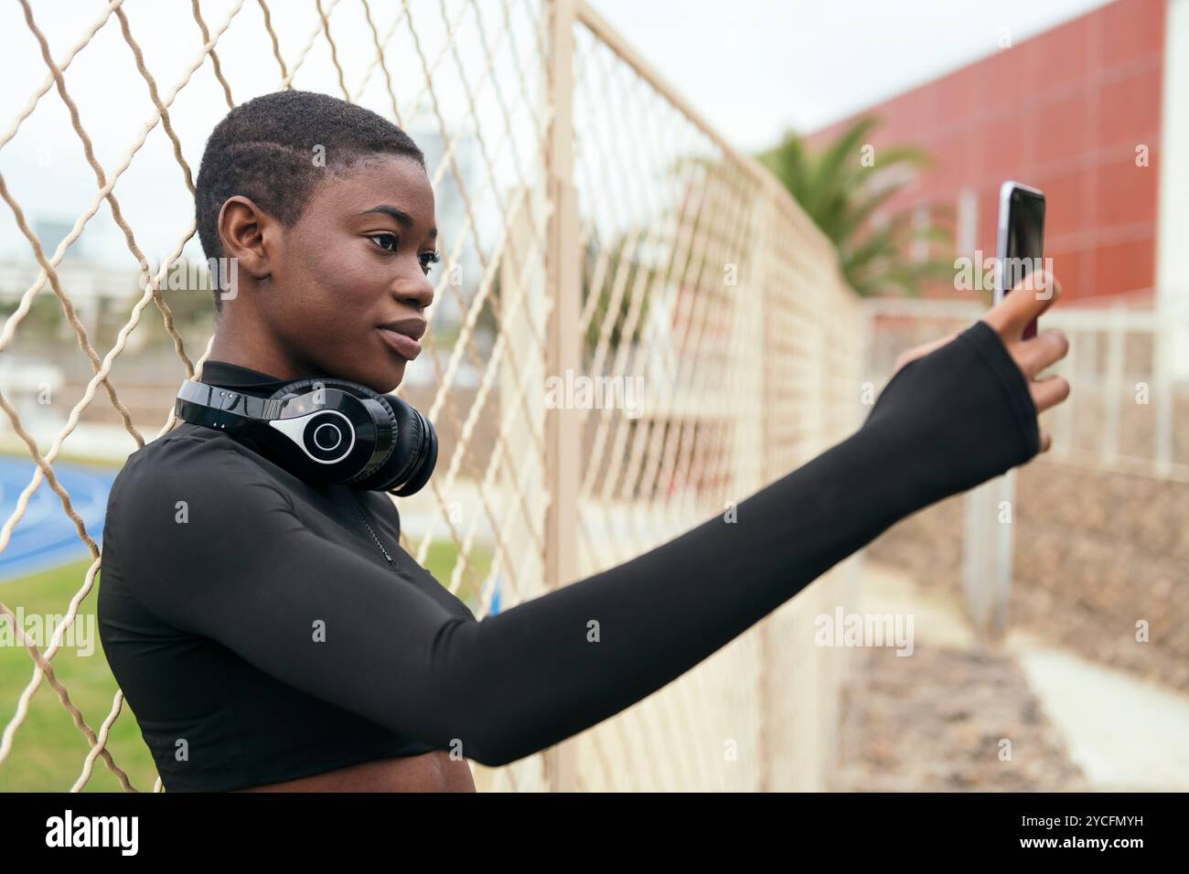 female with wireless headset taking selfie Stock Photo