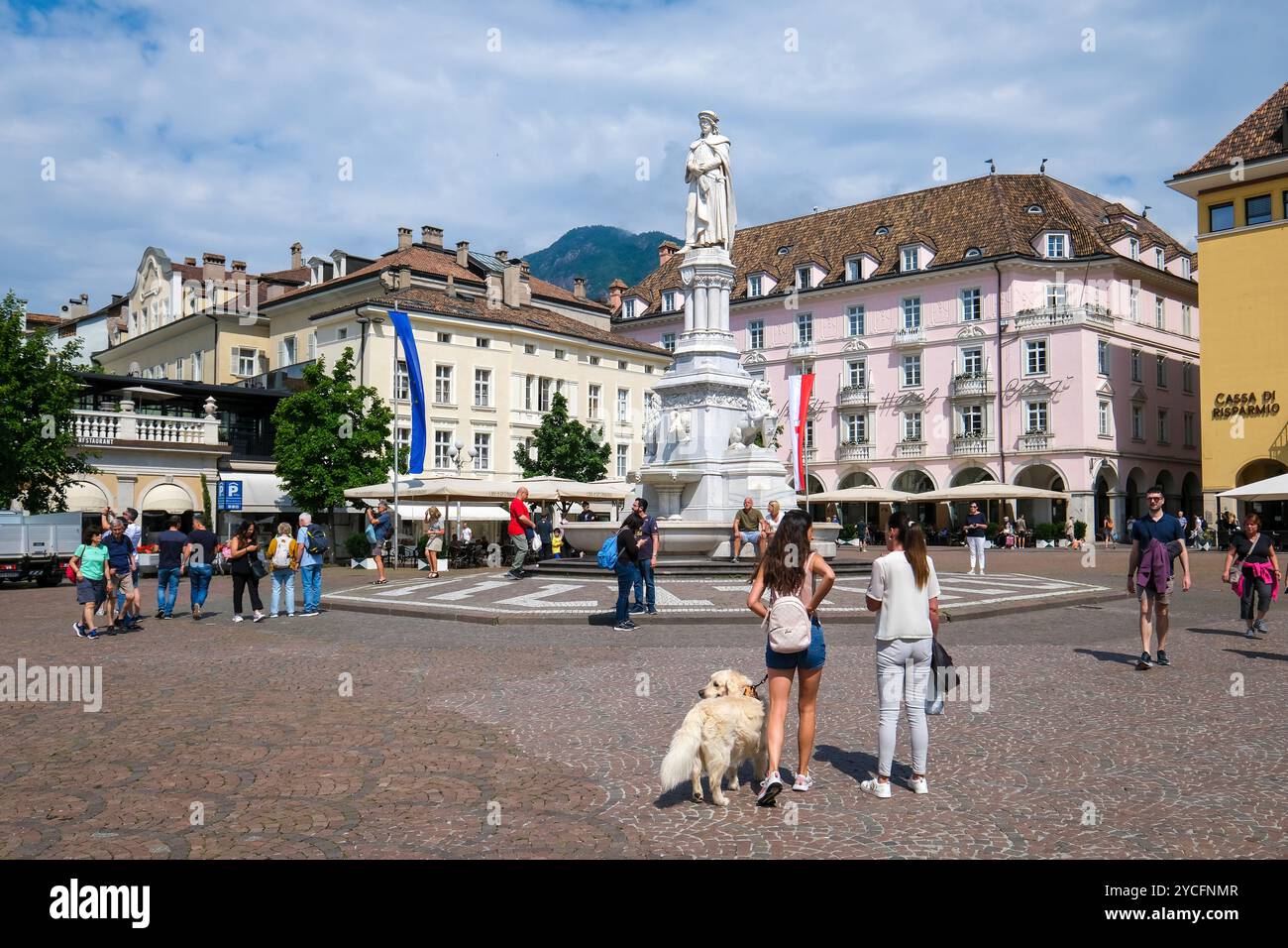 Bolzano, South Tyrol, Italy, Waltherplatz square with monument to Walther von der Vogelweide, passers-by stroll across the squares and through the alleyways of the old town. Stock Photo