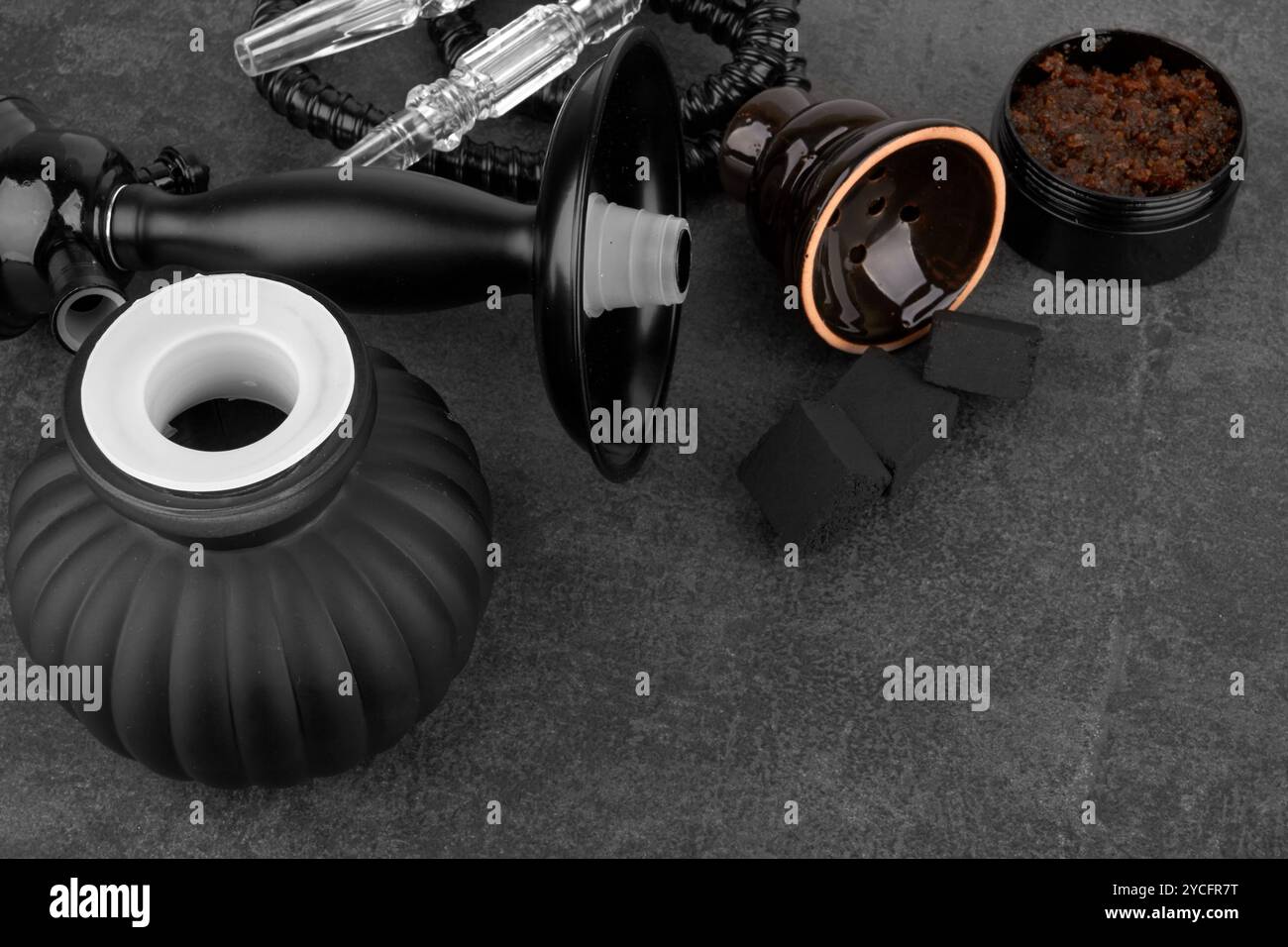 Black hookah on a black stone surface Stock Photo
