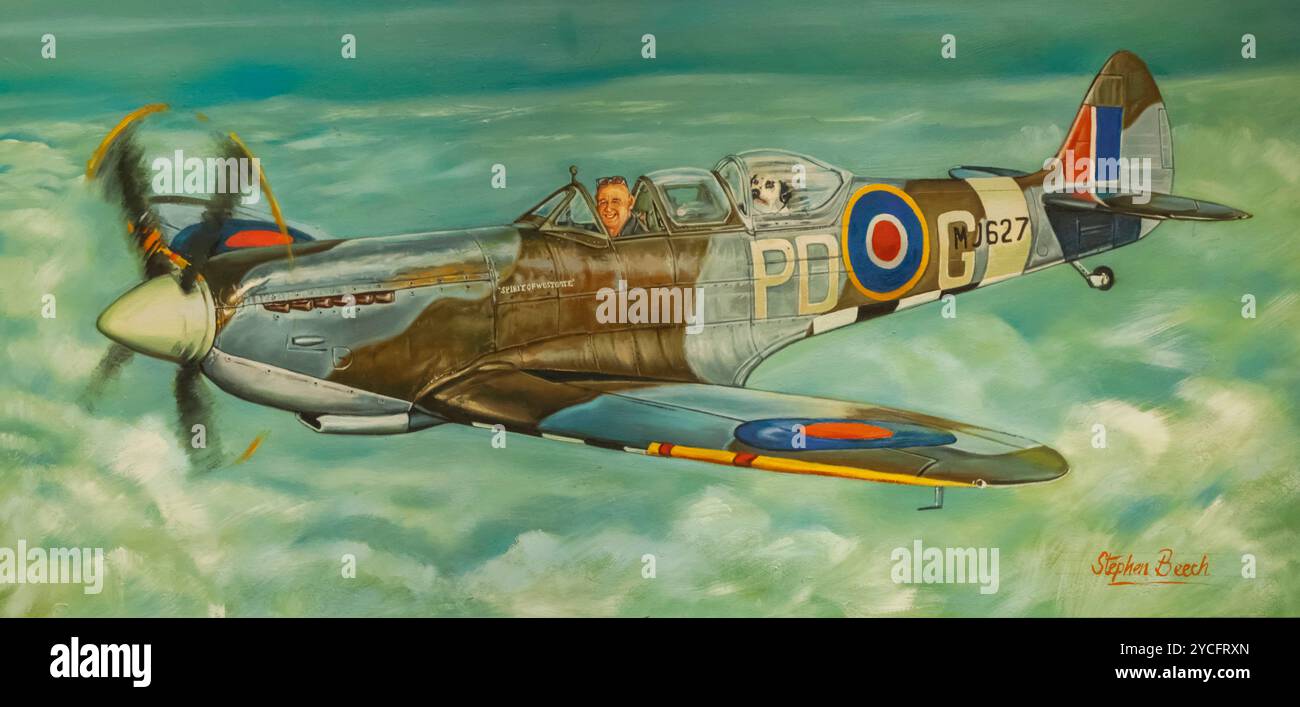 England, Kent, Thanet, Ramsgate, Manston, The Spitfire and Hurricane Memorial Museum, Amusing Painting of Man and Dog flying a Spitfire by Stephen Beech Stock Photo