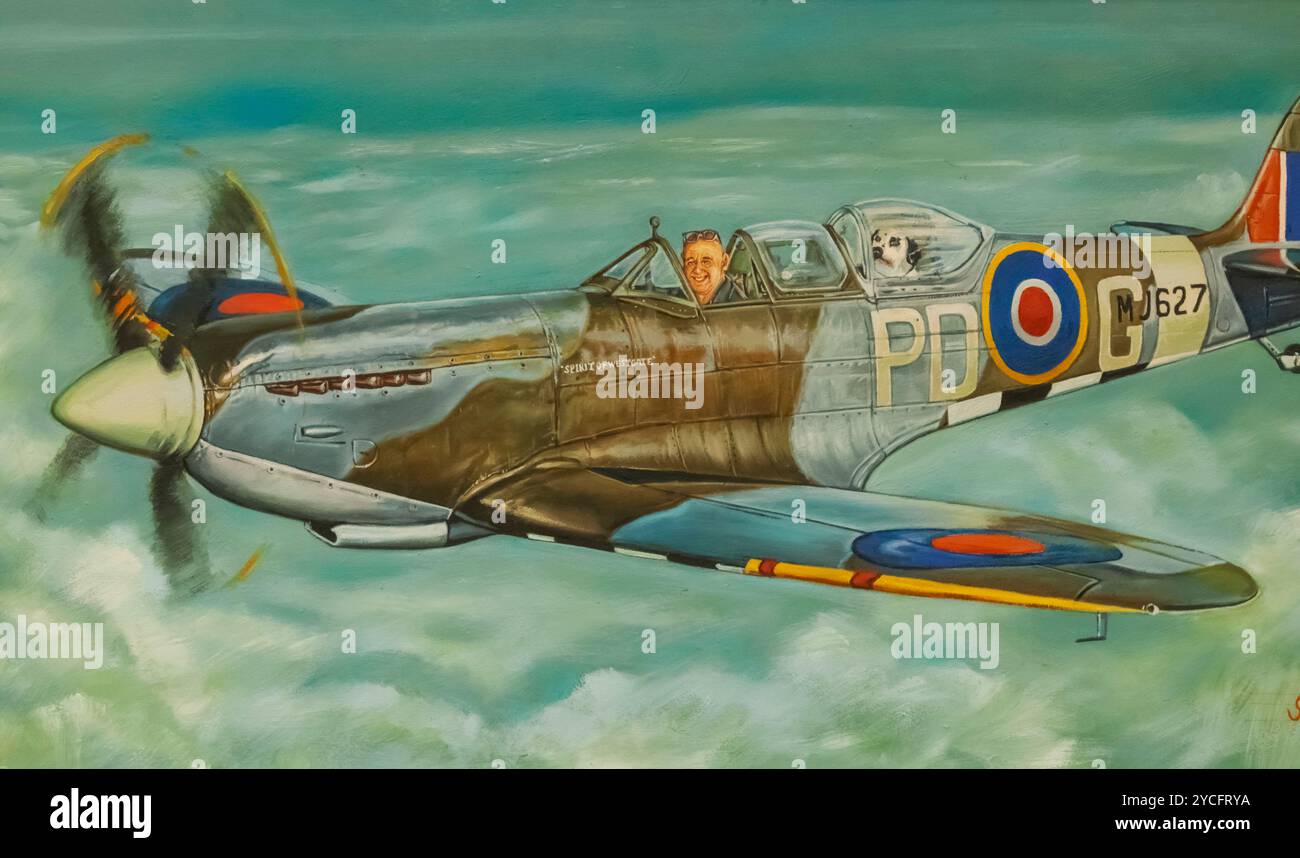 England, Kent, Thanet, Ramsgate, Manston, The Spitfire and Hurricane Memorial Museum, Amusing Painting of Man and Dog flying a Spitfire by Stephen Beech Stock Photo