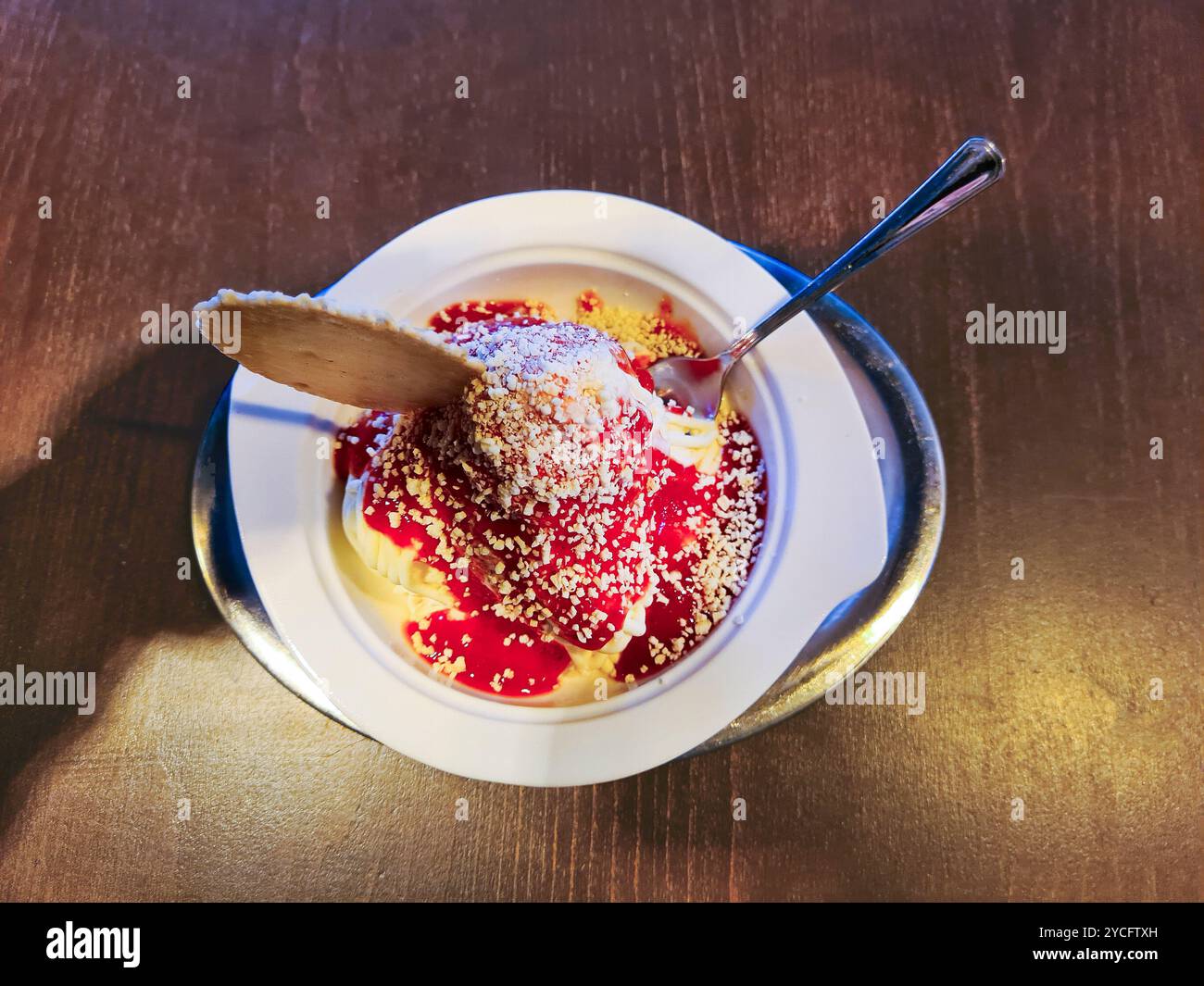 Vanilla ice cream with red strawberry sauce and white chocolate ...