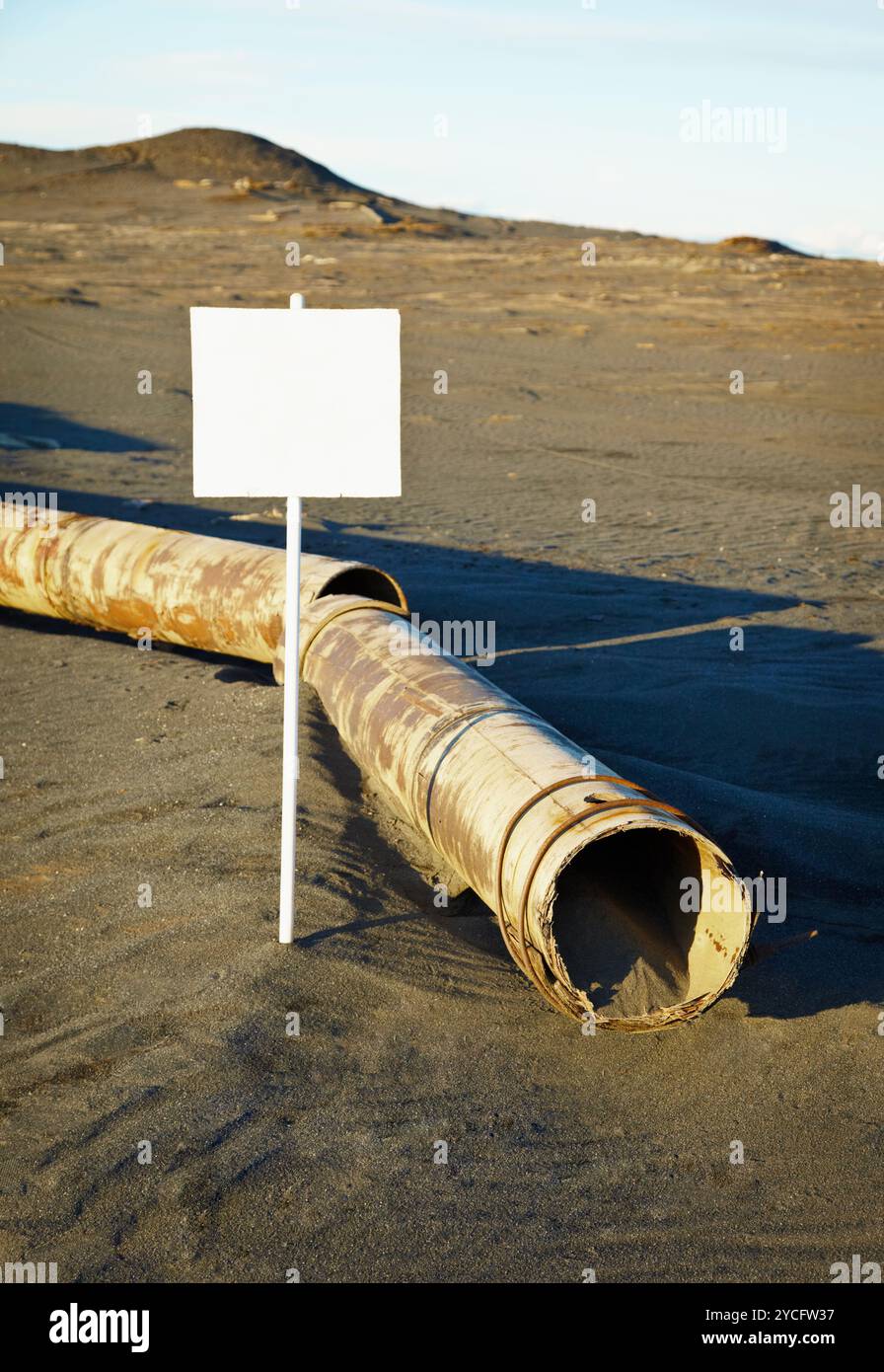Sign near old rotting pipe - ecological disaster Stock Photo - Alamy