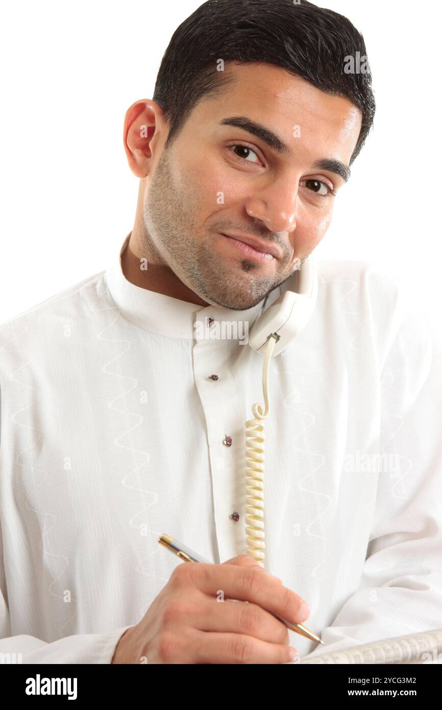 Businessman on phone call with newspaper Stock Photo
