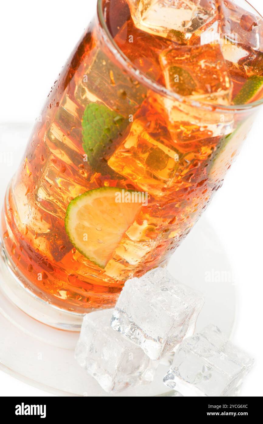 Glass of iced tea with ice cubes, lime and mint Stock Photo - Alamy