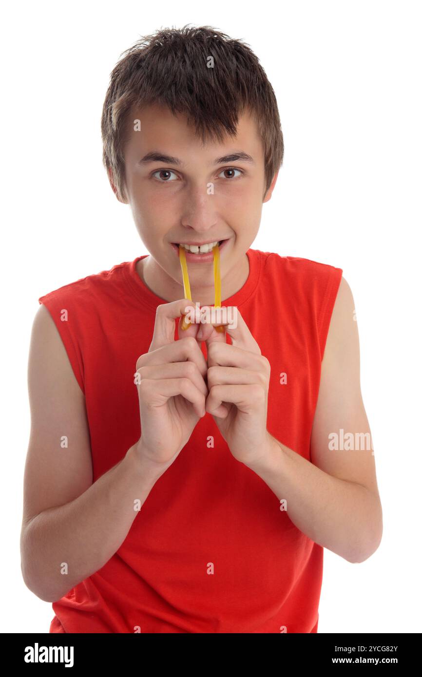 A boy eating soft jelly lollies Stock Photo - Alamy