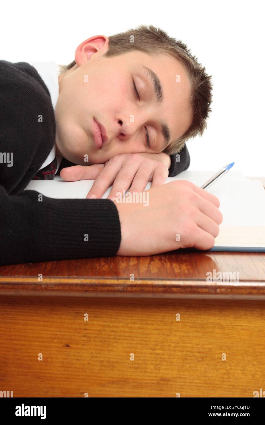 Tired bored student at desk Stock Photo