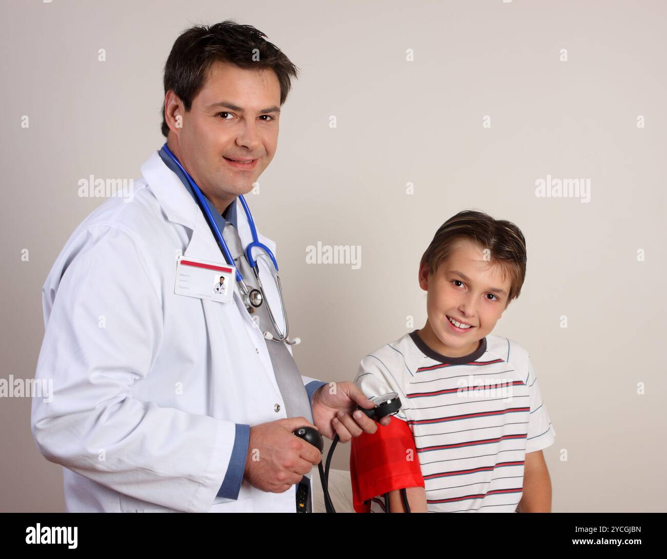 Doctor checking blood pressure child hi-res stock photography and ...