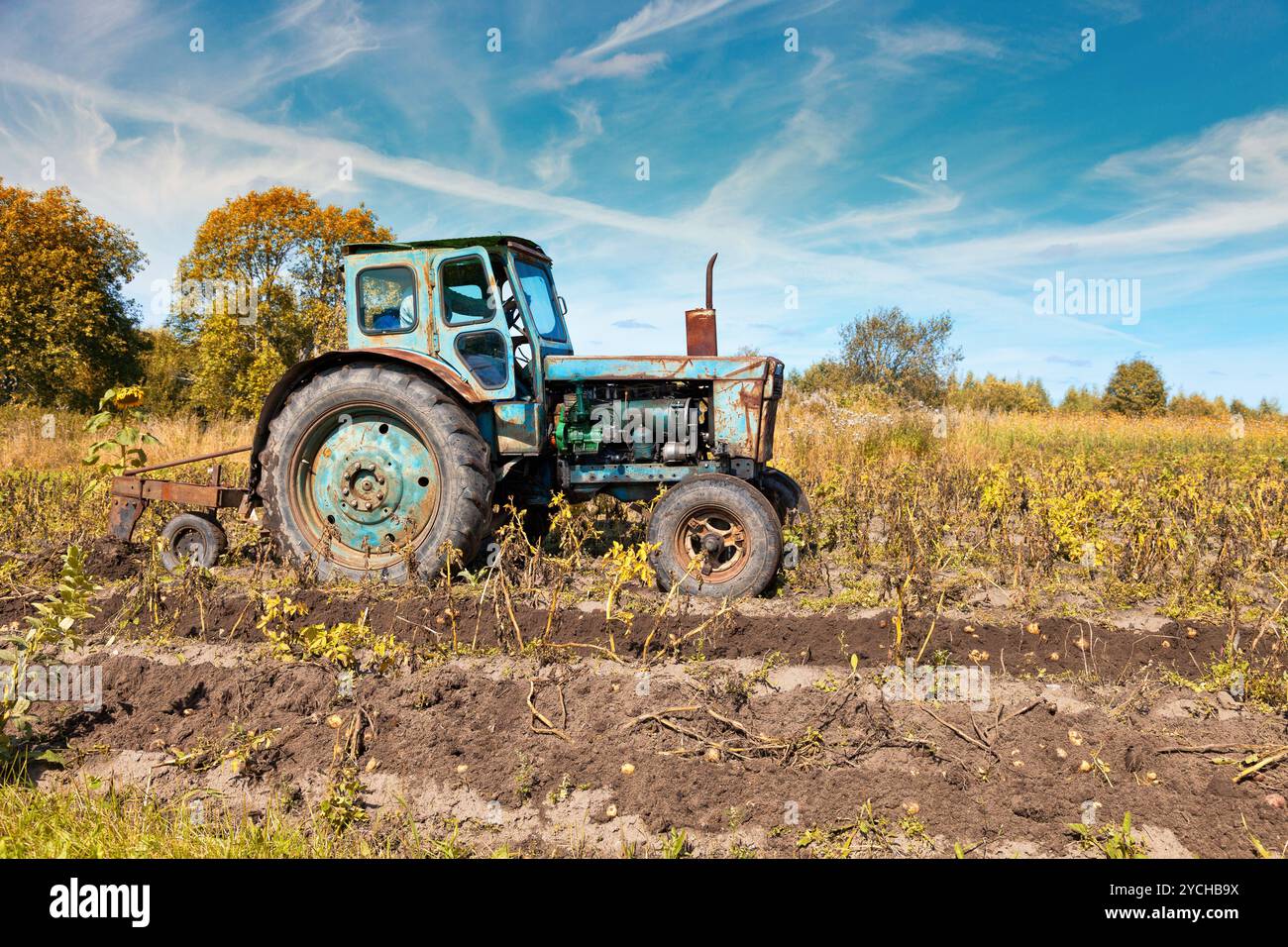 Old tractor in the field Stock Photo - Alamy