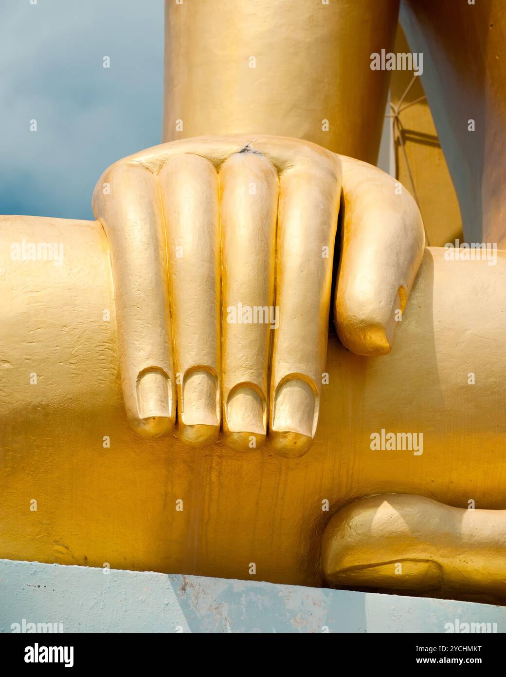 Big golden Buddhas hand. Thailand Stock Photo