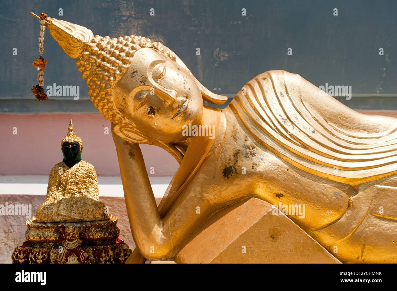 Golden statue of resting Buddha. Thailand Stock Photo