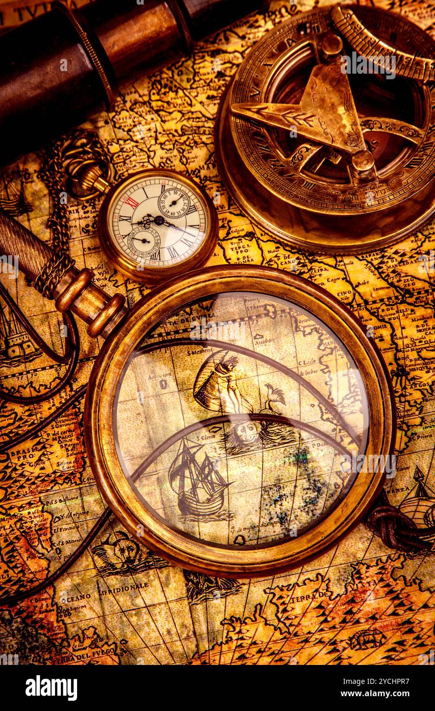 Vintage magnifying glass lies on an ancient world map Stock Photo - Alamy