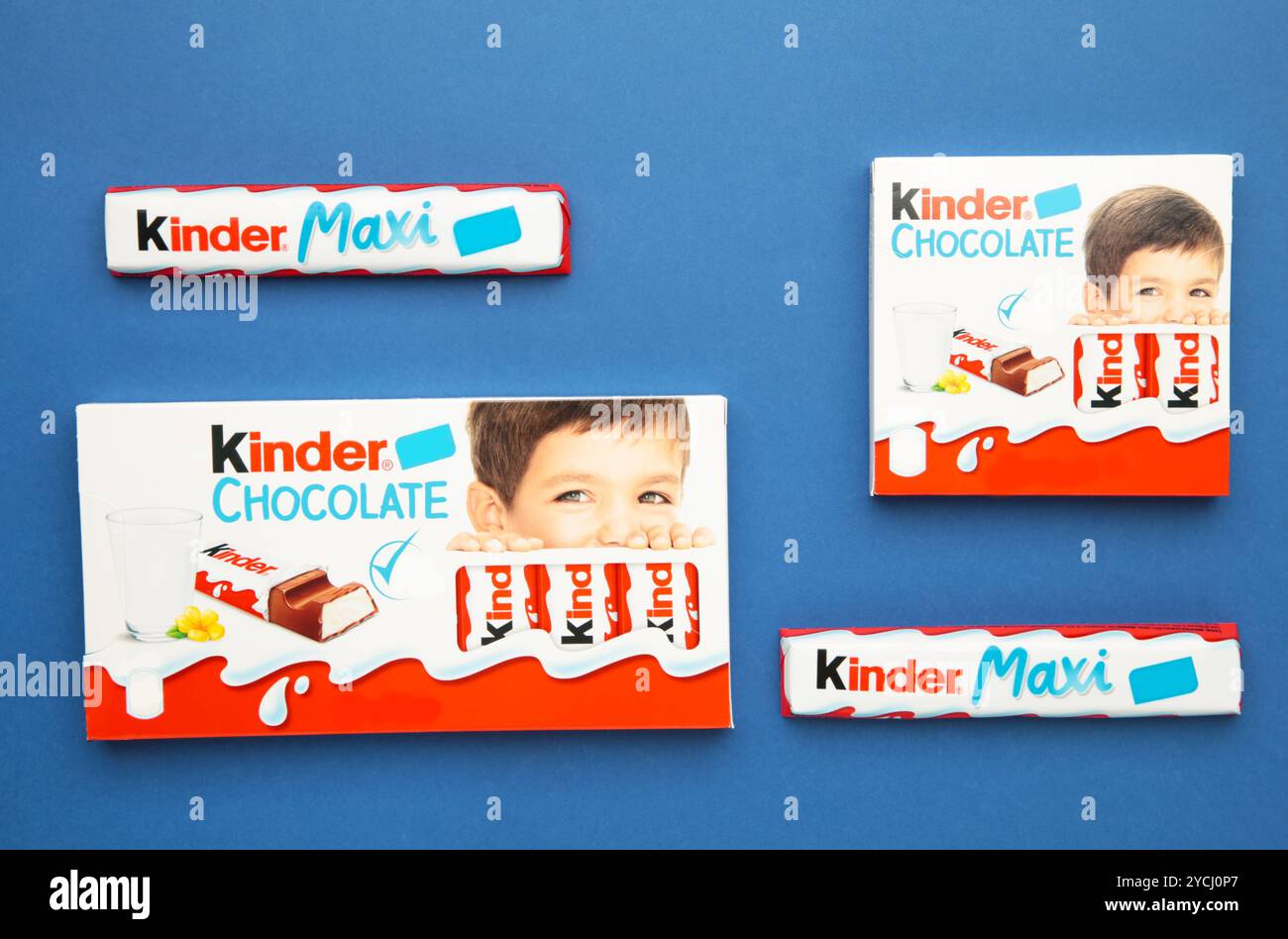 Mykolaiv, Ukraine - July 28, 2023: Kinder chocolate bars on blue background. Stock Photo