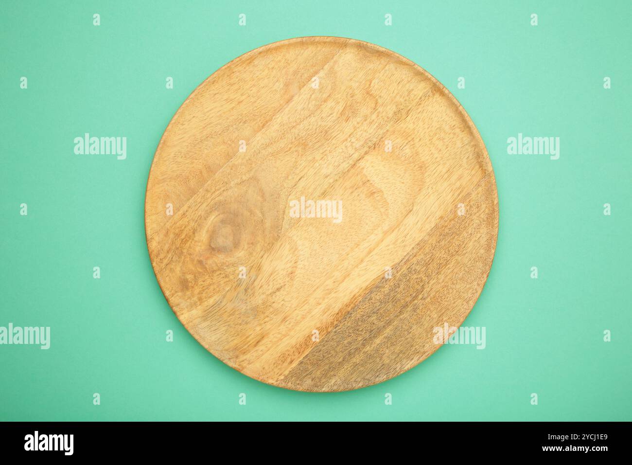 Empty wooden tray on mint background. Rectangular wooden dish. Top view Stock Photo