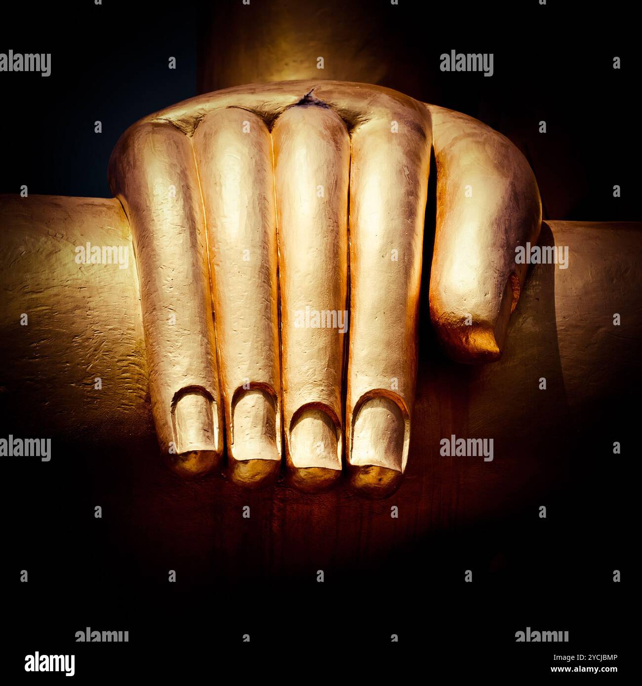 Big golden Buddhas hand. Thailand Stock Photo