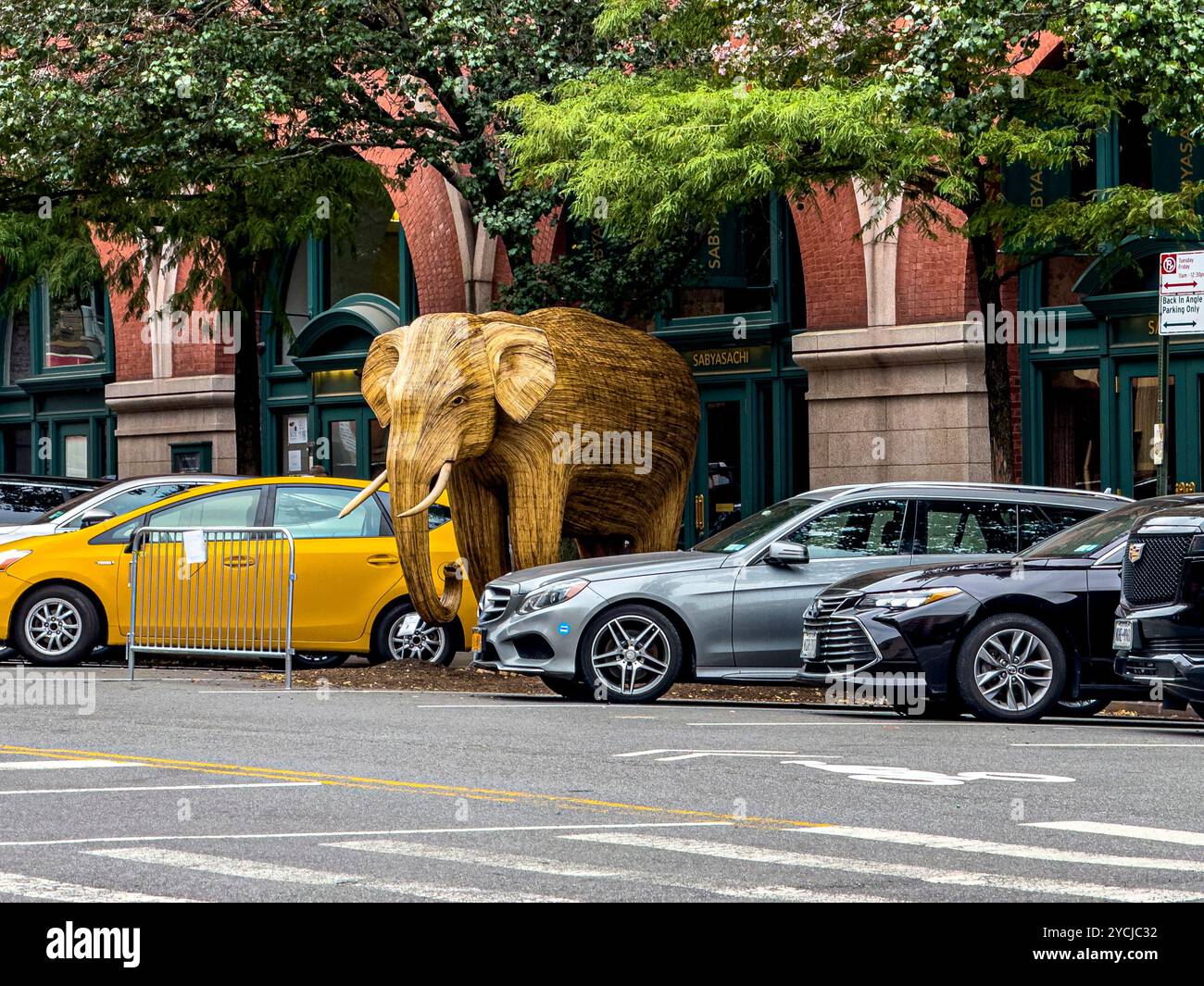 Great Elephant Migration sculpture by the Coexistence Collective, constructed by Indian indigenous artisans out of the Lantana camara, New York City - Smartphone Captured Stock Image