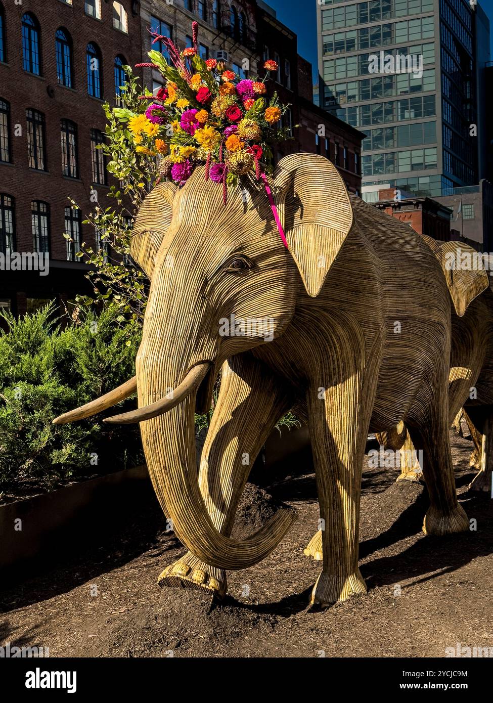 Great Elephant Migration sculpture by the Coexistence Collective, constructed by Indian indigenous artisans out of the Lantana camara, New York City - Smartphone Captured Stock Image