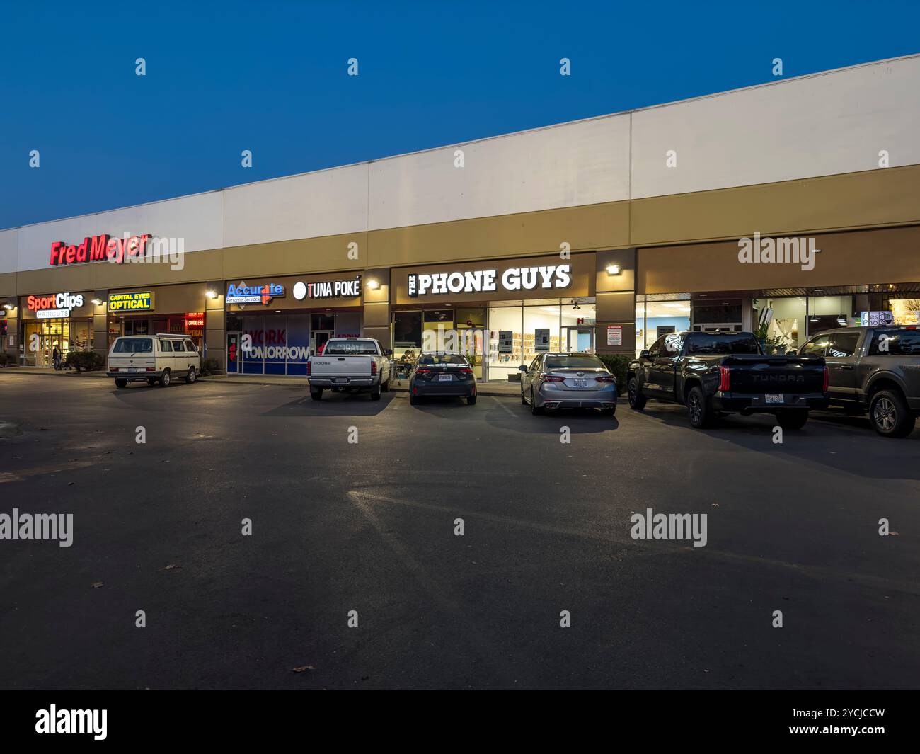 Fred Meyer (Kroger) store anchors this mini-mall with a number of storefronts in Lacey, Washington. - Smartphone Captured Stock Image