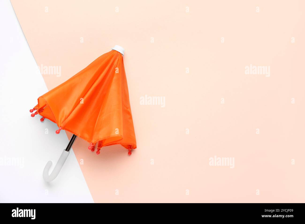 Mini stylish umbrella on colorful background Stock Photo