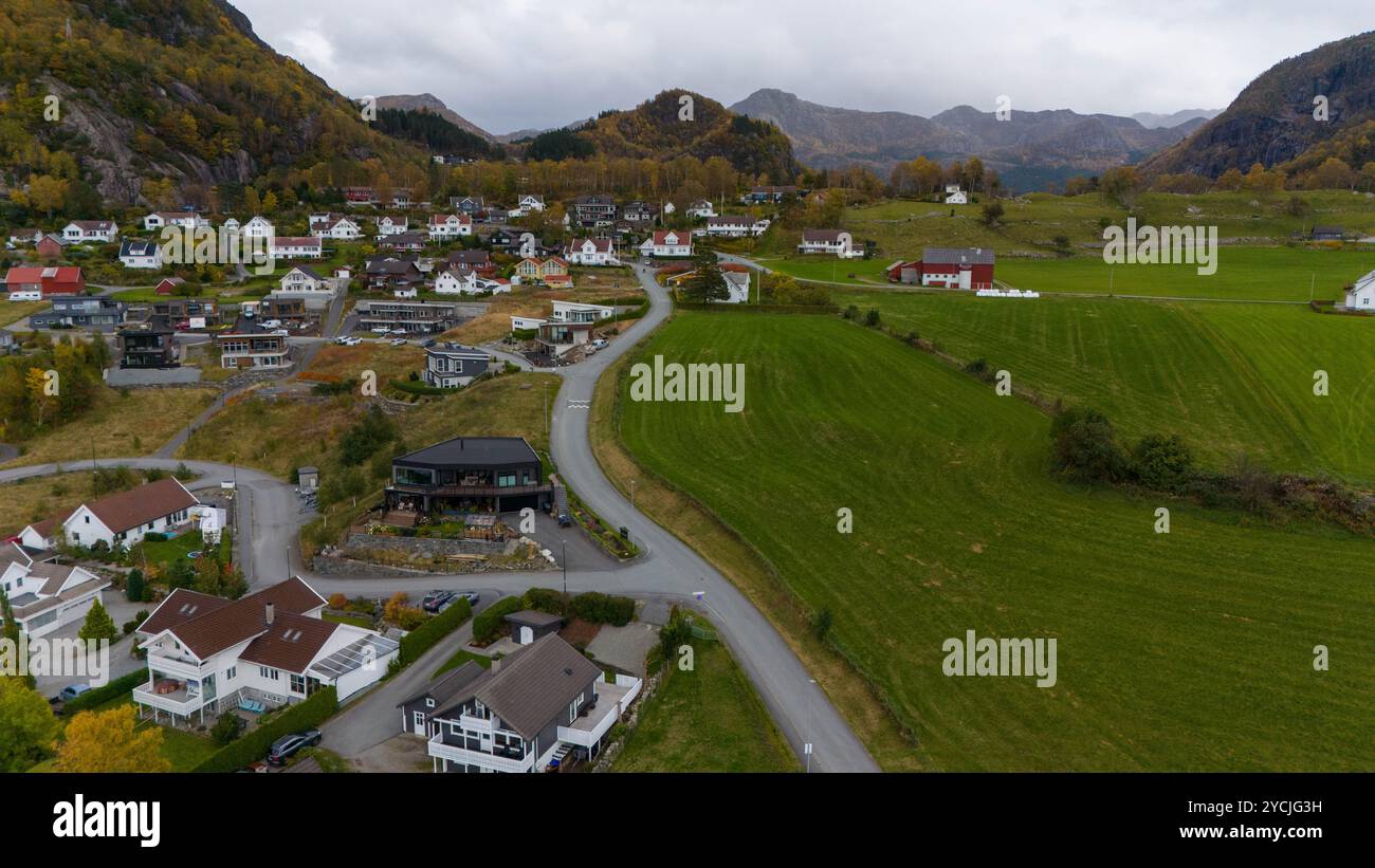 Aerial view of a picturesque village surrounded by mountains and lush ...