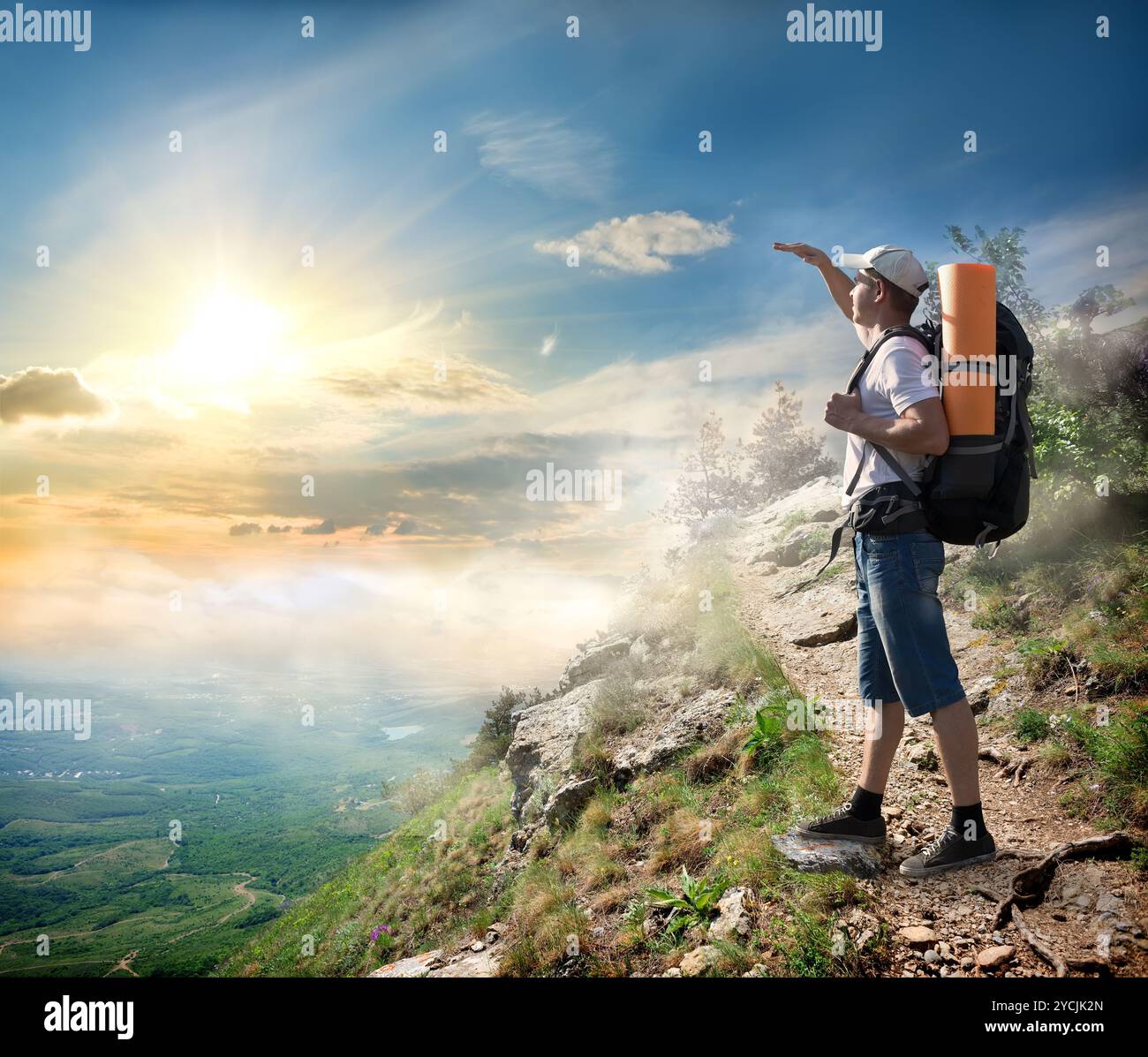 Tourist looking at the sun Stock Photo