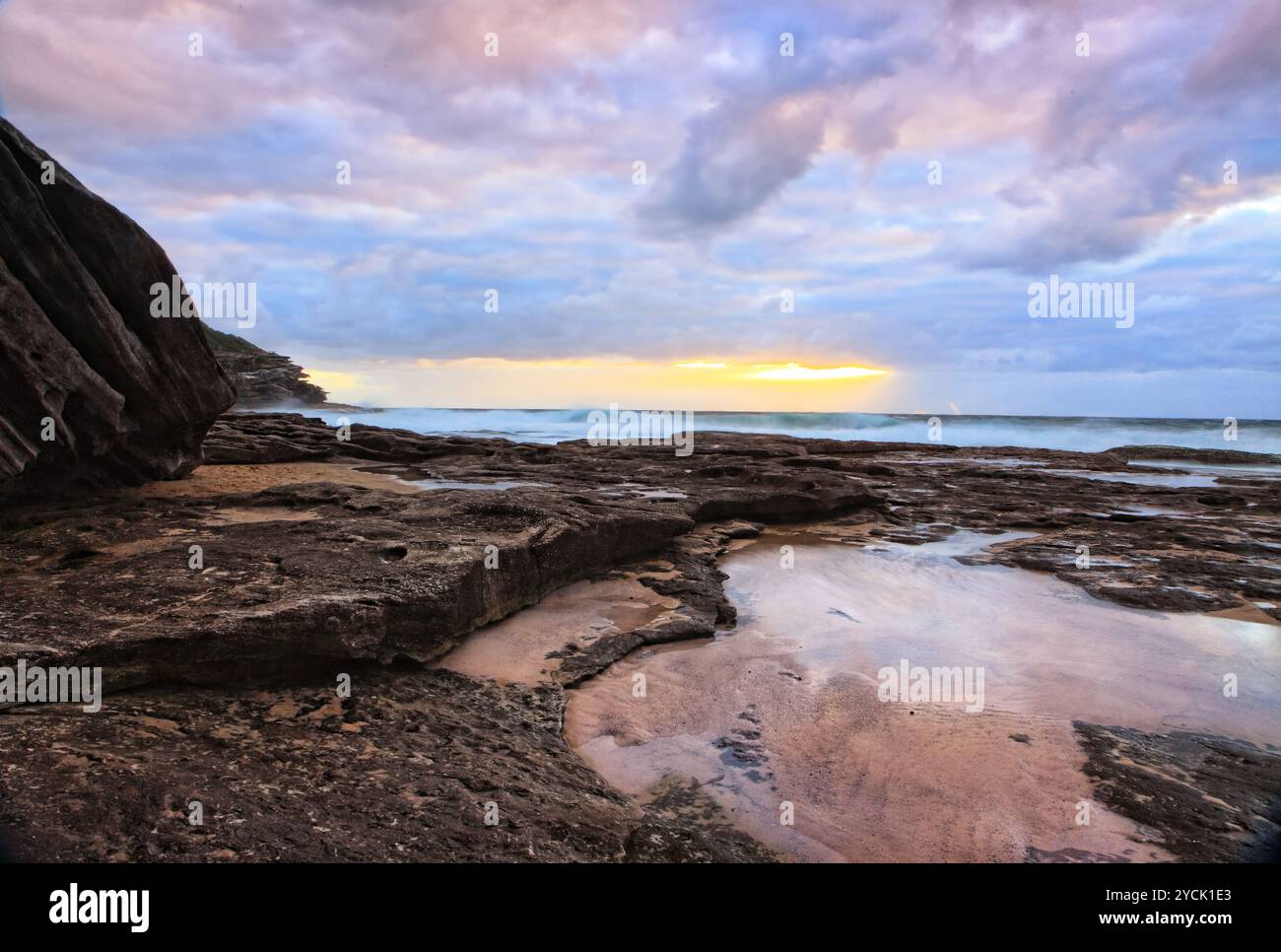 The suns rays break through the clouds Stock Photo