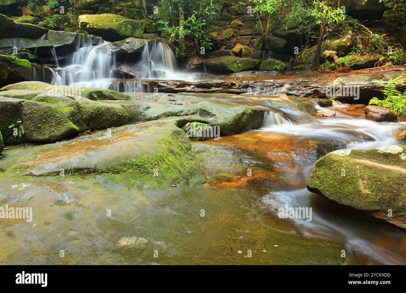 Tranquility waterfalls and moss covered rocks Stock Photo - Alamy