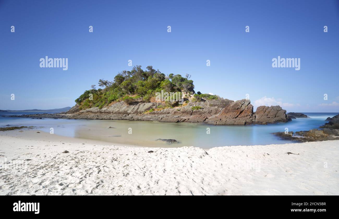 The little island at the southern end of Number One Beach, Seal Rocks, Myall Lakes National Park, Great Lakes, NSW Australia.   The island is surround Stock Photo