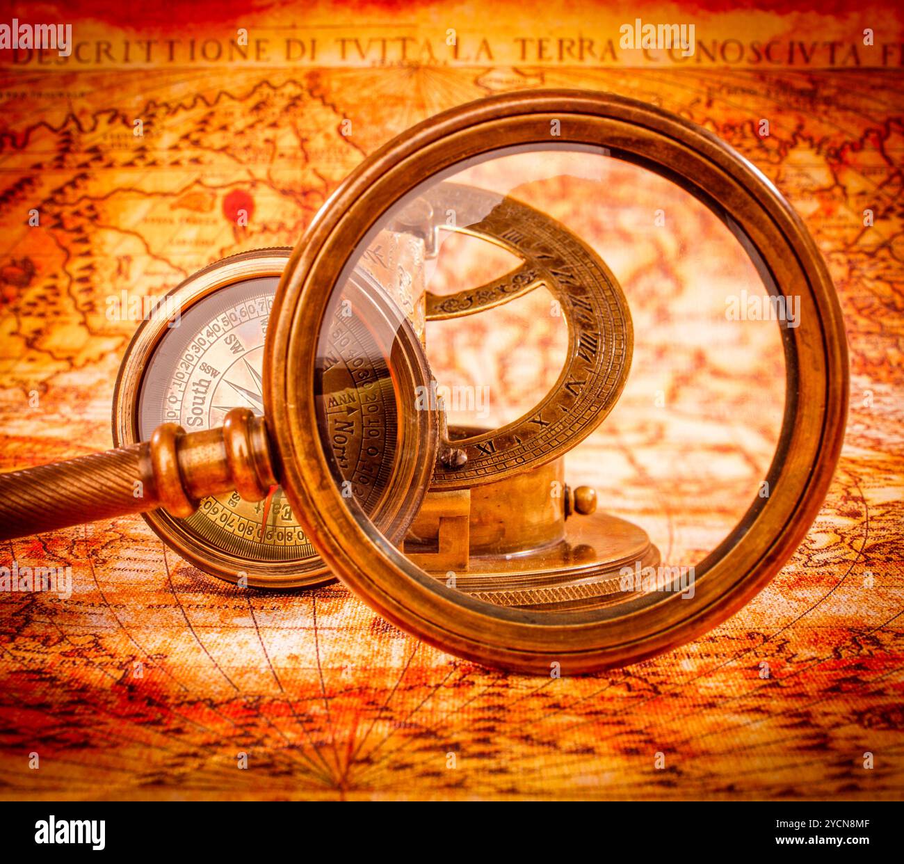 Vintage magnifying glass lies on an ancient world map Stock Photo - Alamy