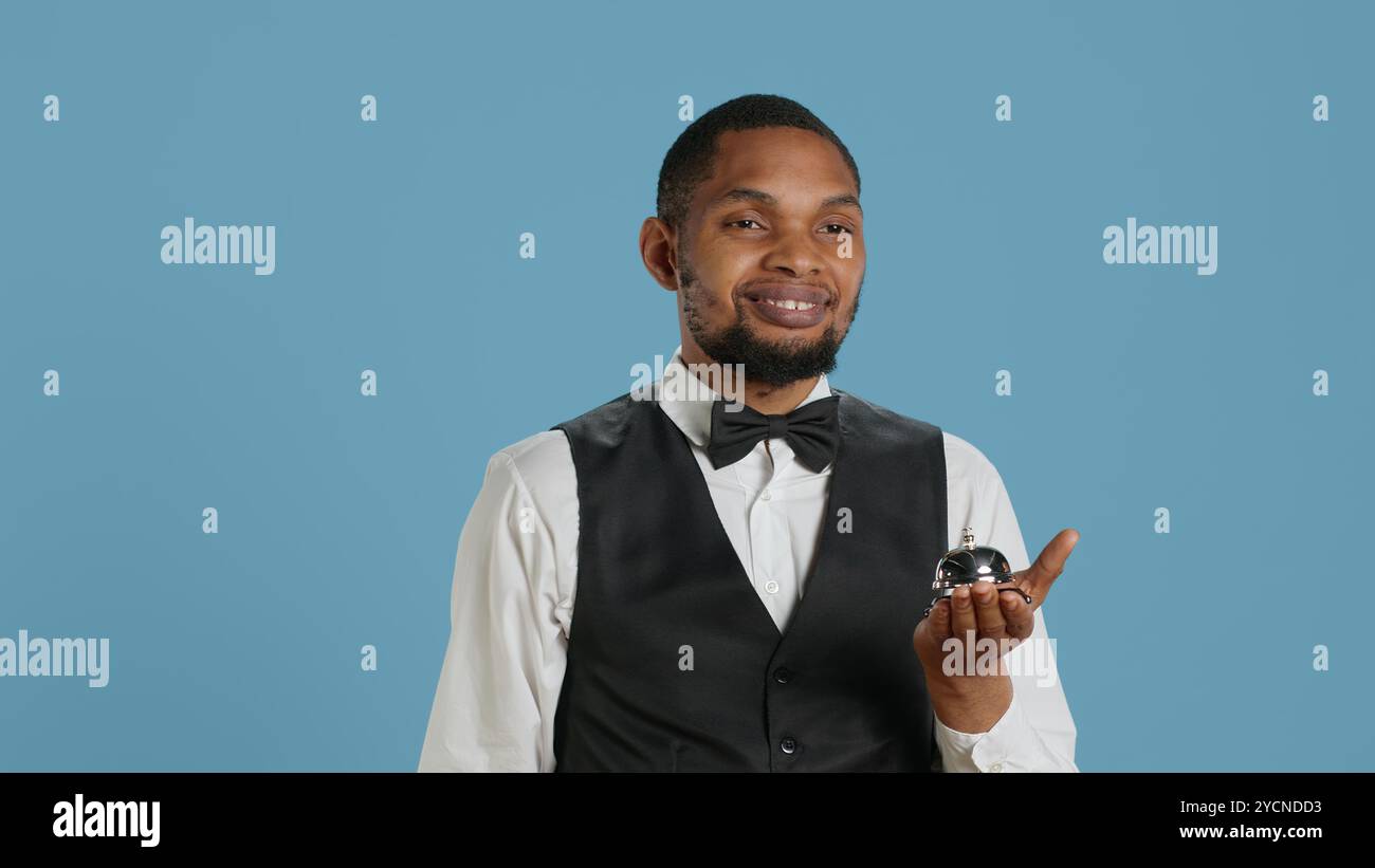 Hotel worker welcoming guests hi-res stock photography and images - Alamy