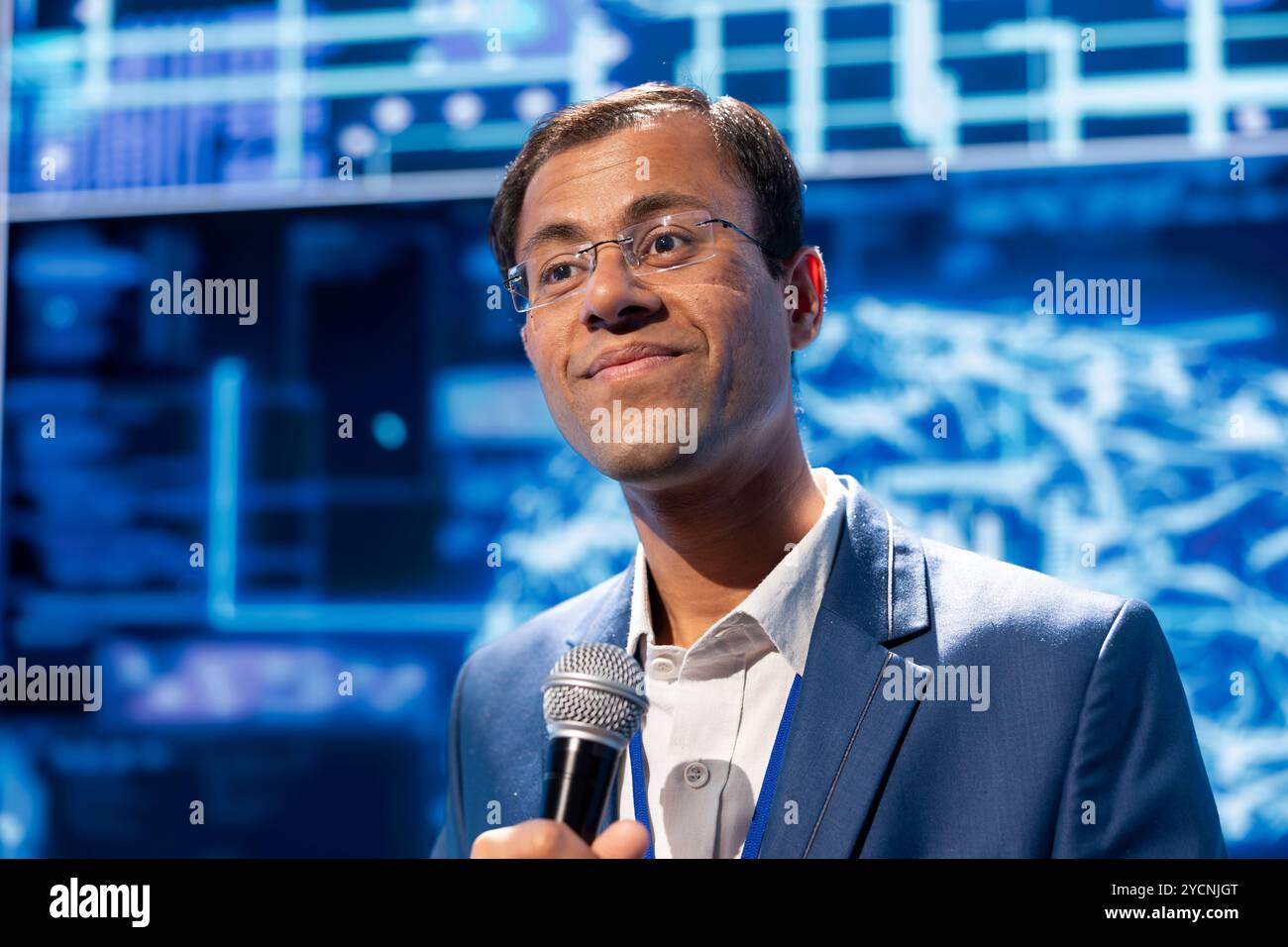 Speaker talking at tech conference, exploring latest AI technology ...