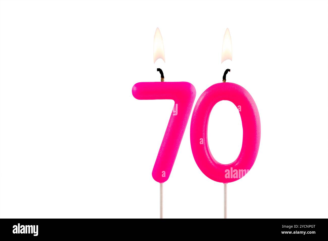 Pink number 70 birthday candle lit on white background Stock Photo - Alamy