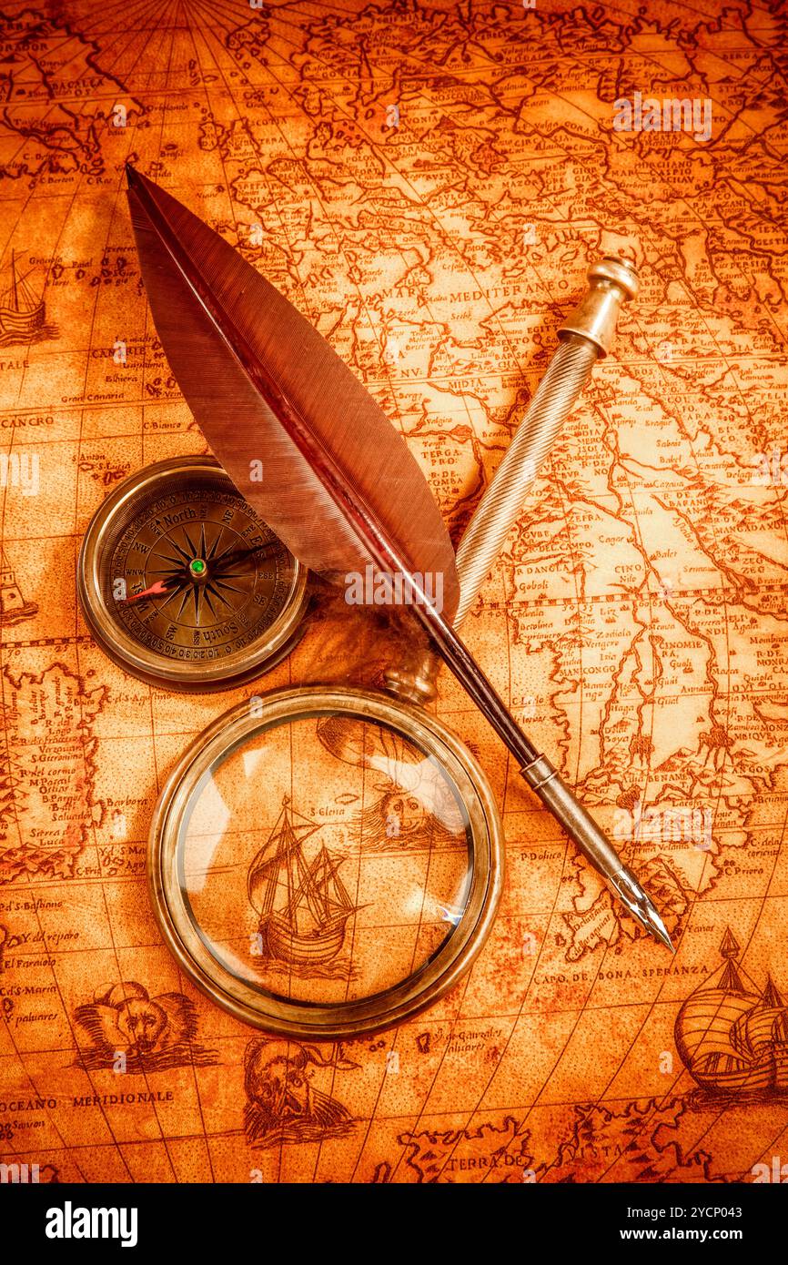 Vintage magnifying glass lies on an ancient world map Stock Photo - Alamy
