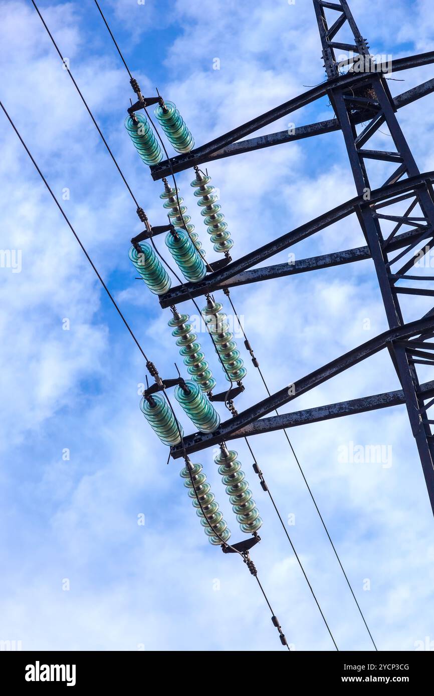 High voltage electric tower against blue sky Stock Photo - Alamy