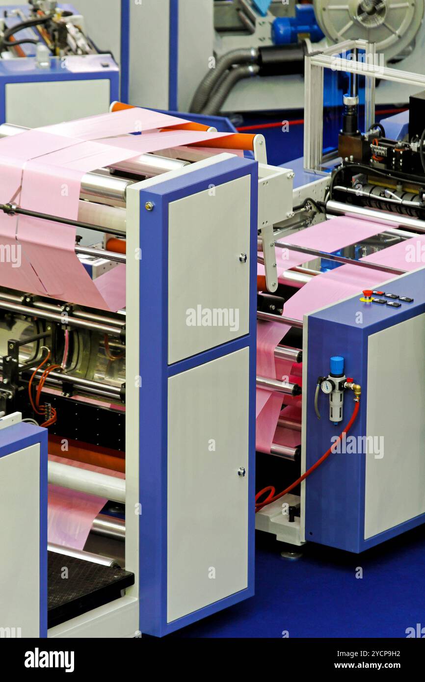 Machine polyethylene production plastic bags hi-res stock photography ...