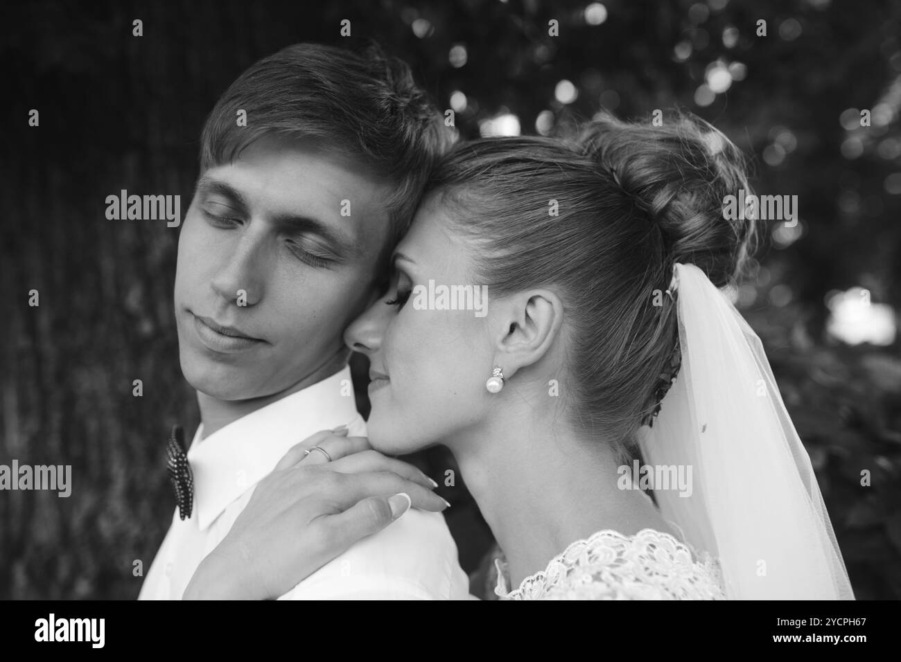 Bride and groom in the forest Stock Photo