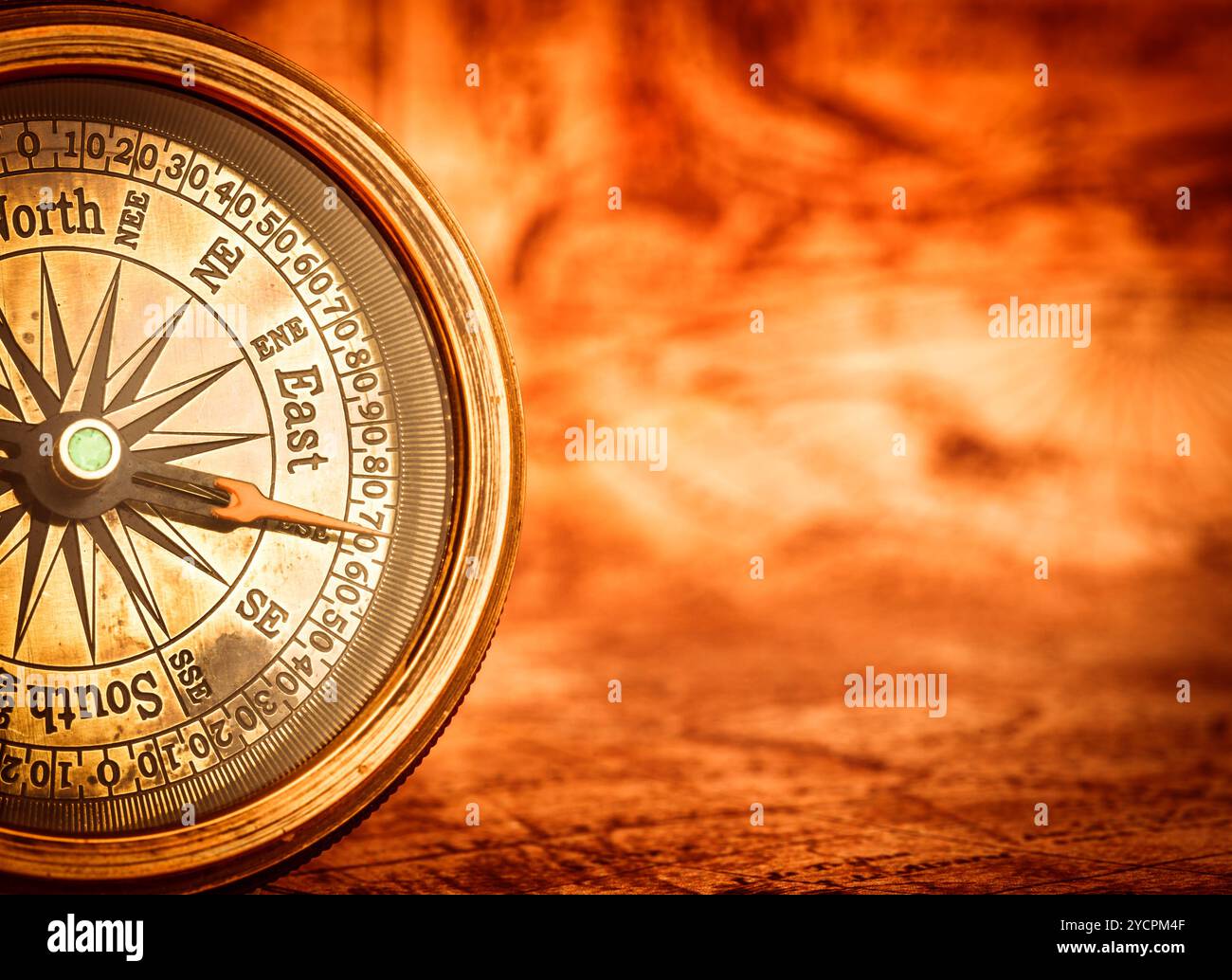 Vintage compass lies on an ancient world map Stock Photo - Alamy