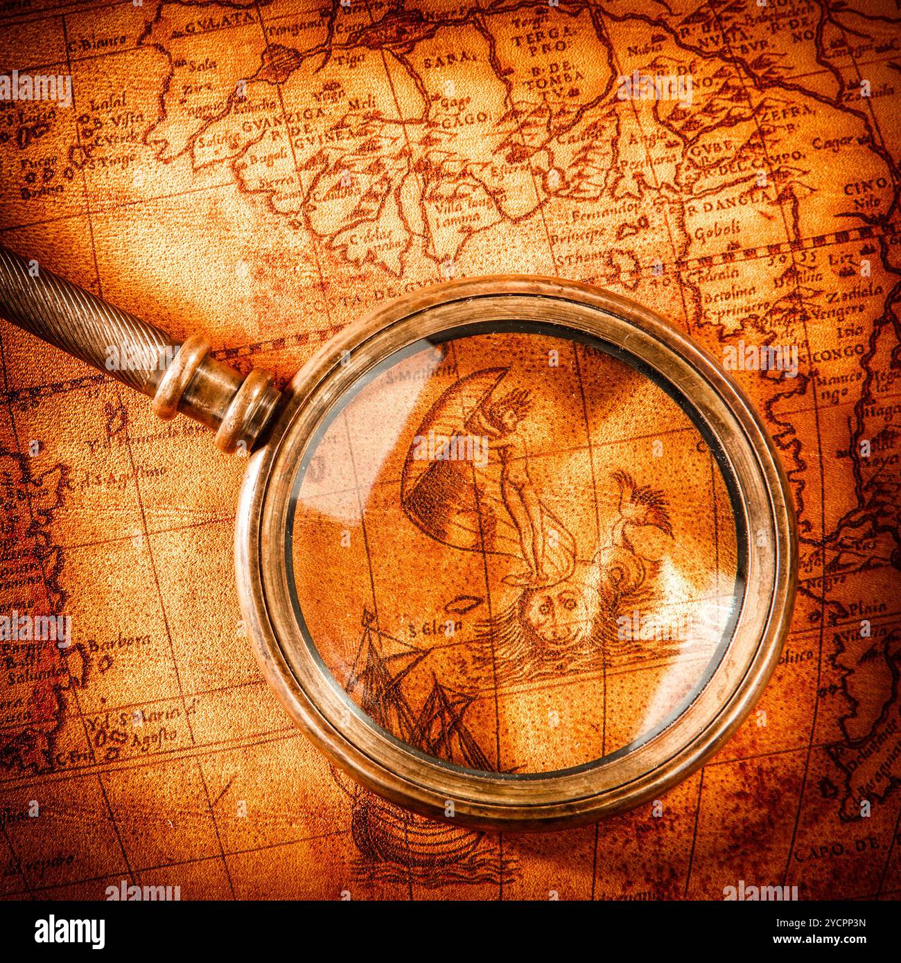 Vintage magnifying glass lies on an ancient world map Stock Photo - Alamy
