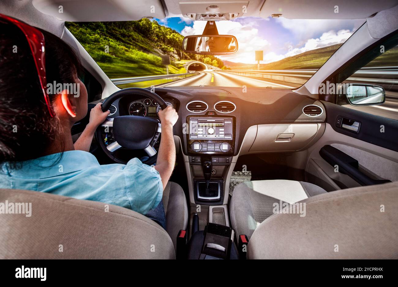 Woman behind the wheel of a car Stock Photo - Alamy