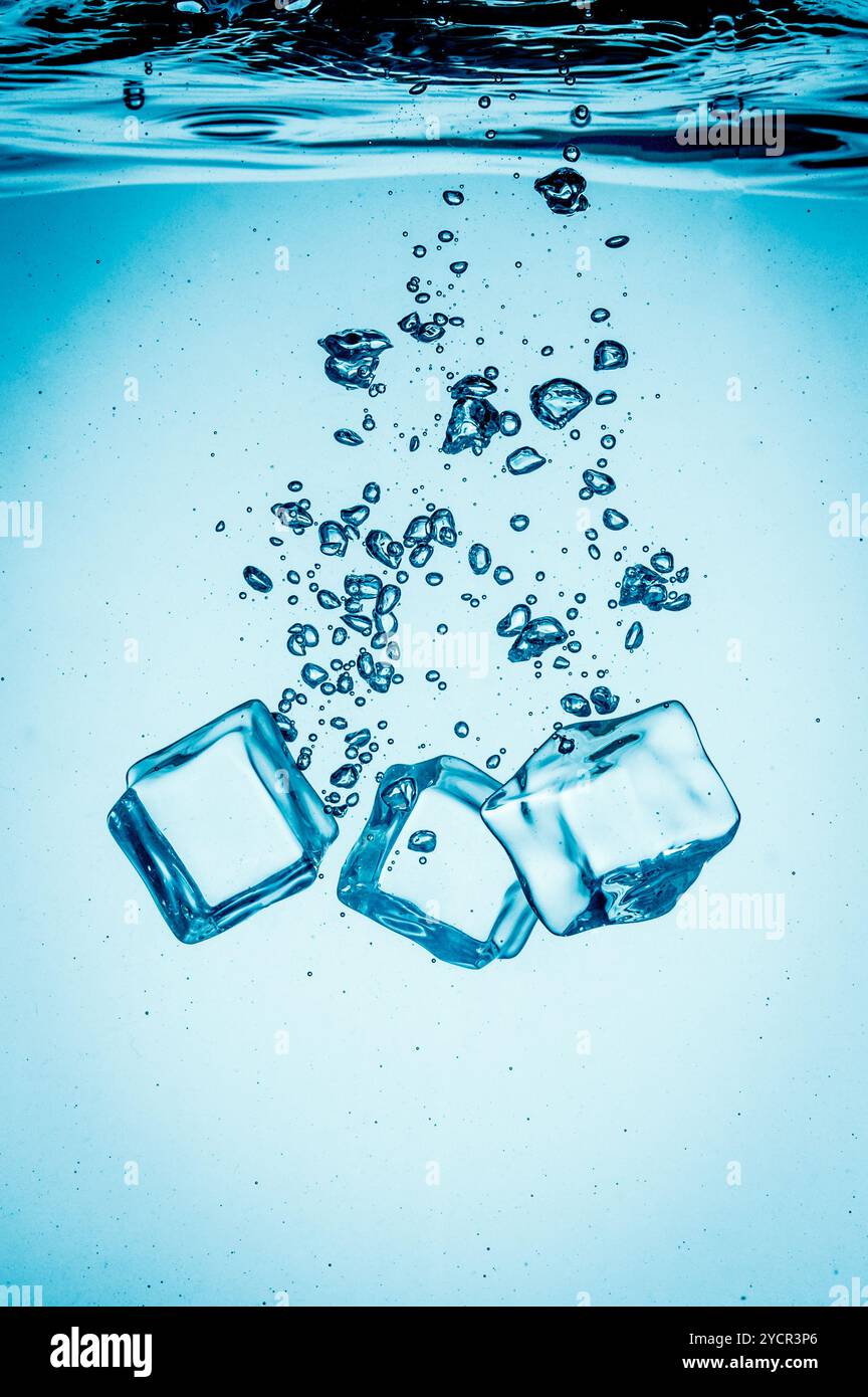 Ice cube falling into liquid hi-res stock photography and images - Alamy